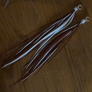 Real rooster saddle earings from a rooster